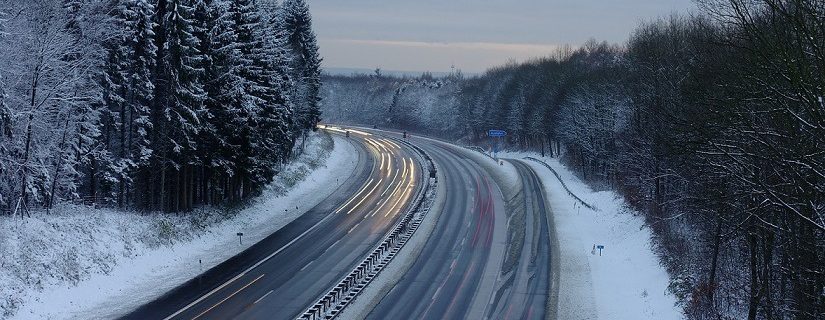 Snowy motorway at dusk in Germany
