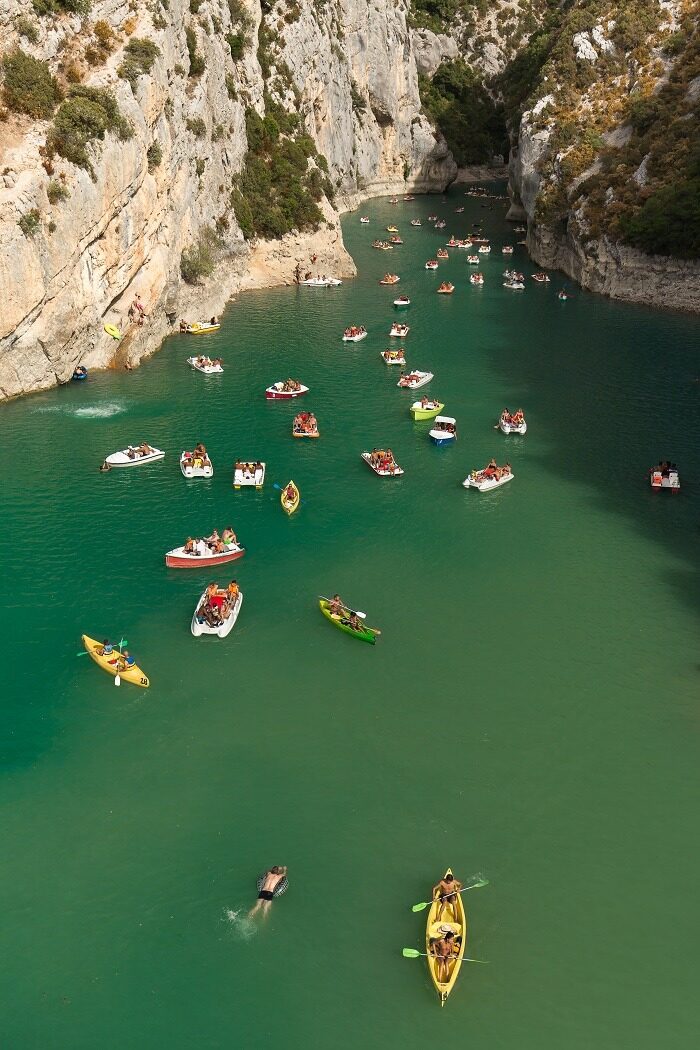 Verdon Natural Regional Park with the boats on the water under the sunlight in France