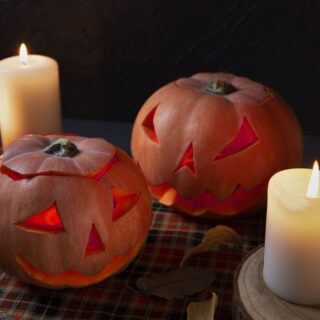 spooky-halloween-carved-pumpkin-lantern-with-lit-candles
